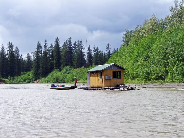 houseboat and fisherman